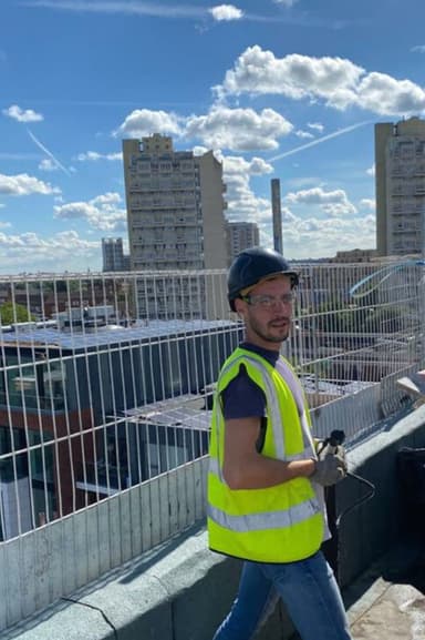 Robert Manaila working on a rooftop installation